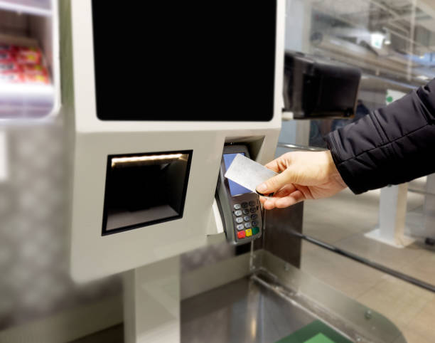 istock Customer pays his purchase at the supermarket,self checkout systems in  retail stores,Barcode scanner,Self checkout machine 1464187395