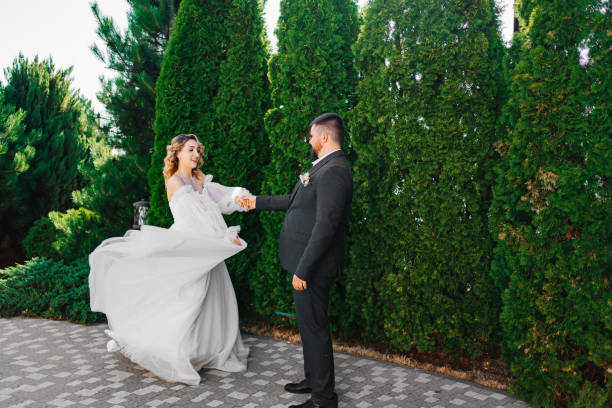 istock dancing bride and groom in the park 1464191884