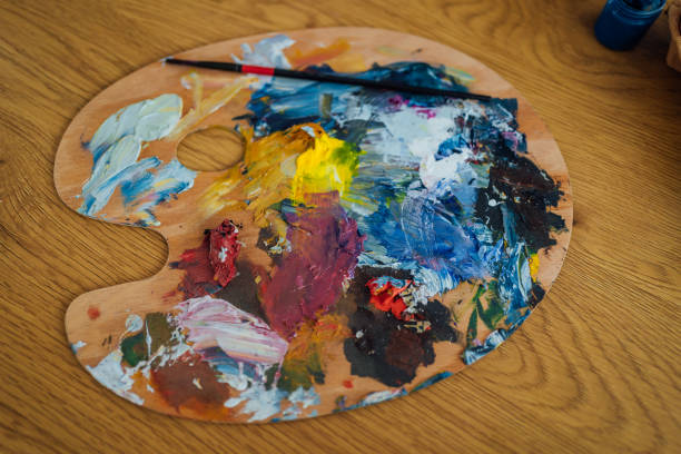 istock Artist's palette with colorful paints 1464191986