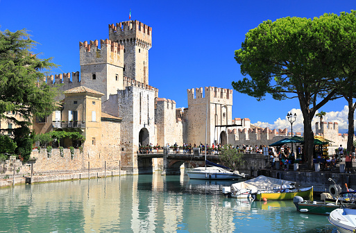 Sirmione, Italy - September 10, 2022: Sightseeing of the Sirmione Castle on Lake Garda on a sunny afternoon.