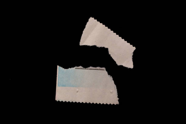 Torn newspaper pieces isolated on black background. Set of ripped papers.