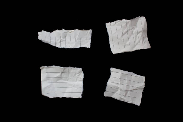 istock Torn paper pieces isolated on black background 1464199954