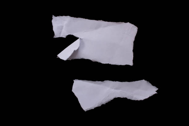 istock Torn paper pieces isolated on black background 1464200013