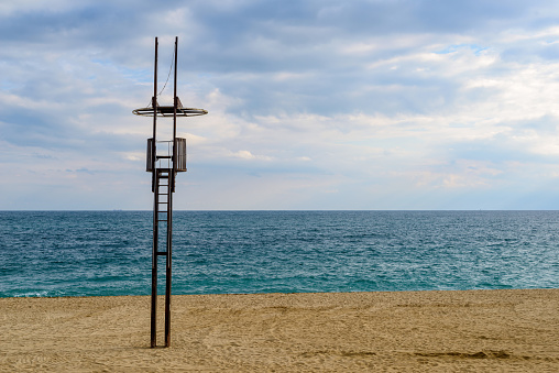 General view of a beach with a watchtower of a lifeguard