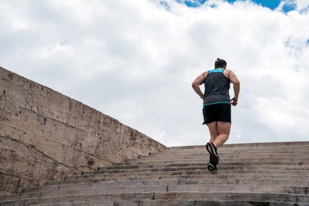 istock Young Man Running in Stairs 1464202189