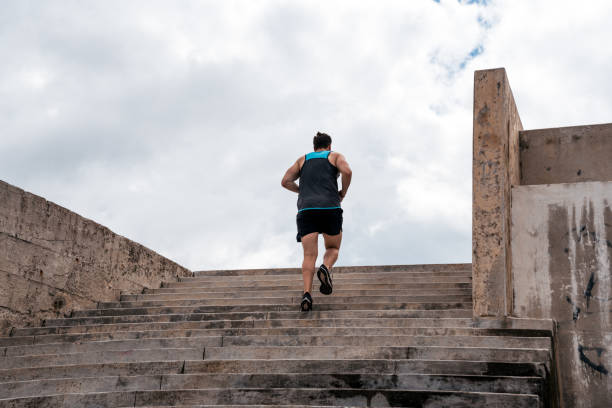 istock Young Man Running in Stairs 1464202194