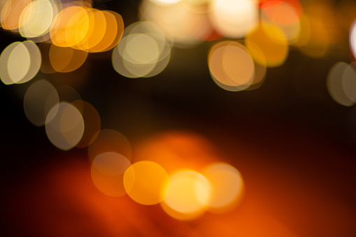 Bokeh background orange lights,Circles of yellow lights out of focus,Amber Light,Backgrounds,Defocused,Textured,Textured Effect,Blurred Motion,