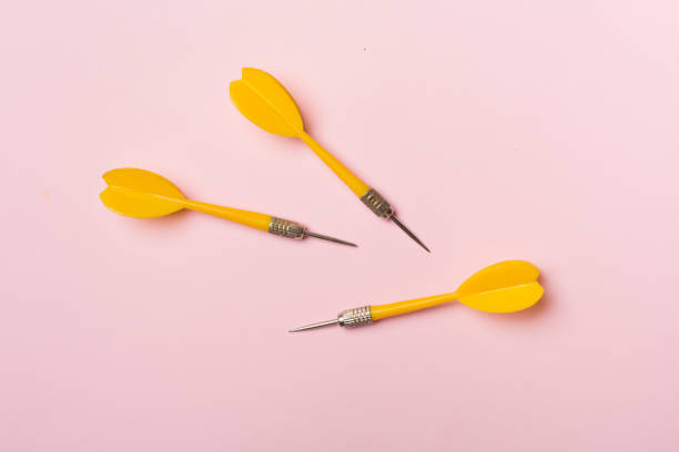 istock Yellow darts on color background, top view 1464202747