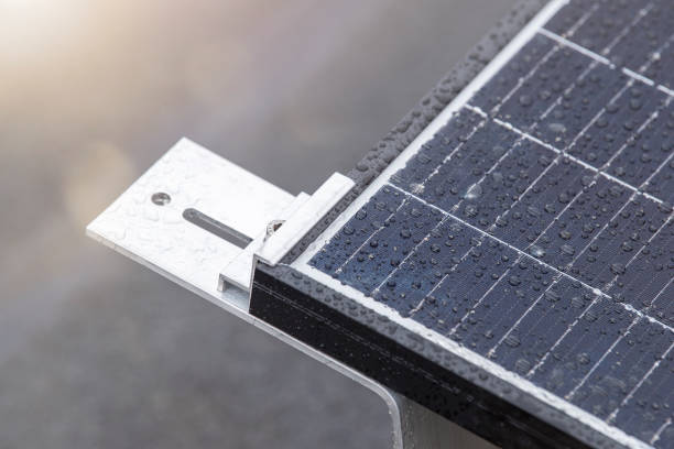 istock Bracket for mounting solar panels. Mounting a solar panel close-up on the roof of a residential building, water drops after rain, green energy production. 1464204641