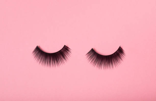 istock False eyelashes on a colored background. Flatley. Beauty and fashion concept. Eyelash extension. beauty industry. Place for text. Place to copy. 1464206039