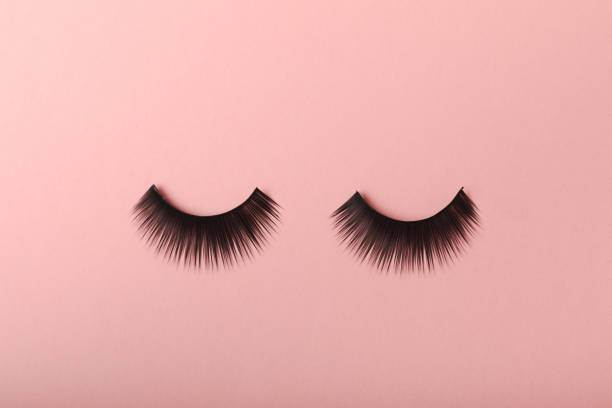 istock False eyelashes on a colored background. Flatley. Beauty and fashion concept. Eyelash extension. beauty industry. Place for text. Place to copy. 1464206048