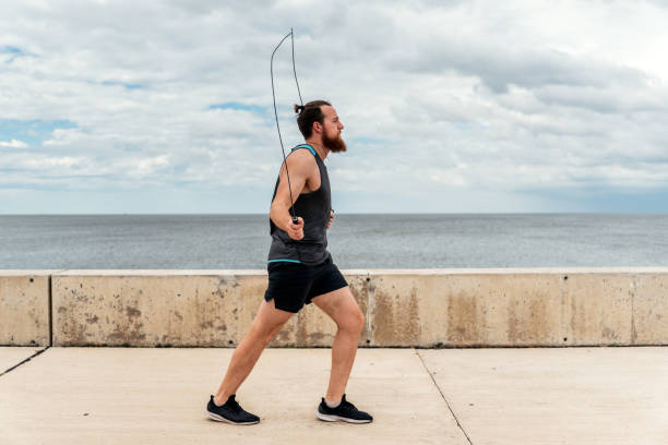 Young Man Exercising Near the Coast
