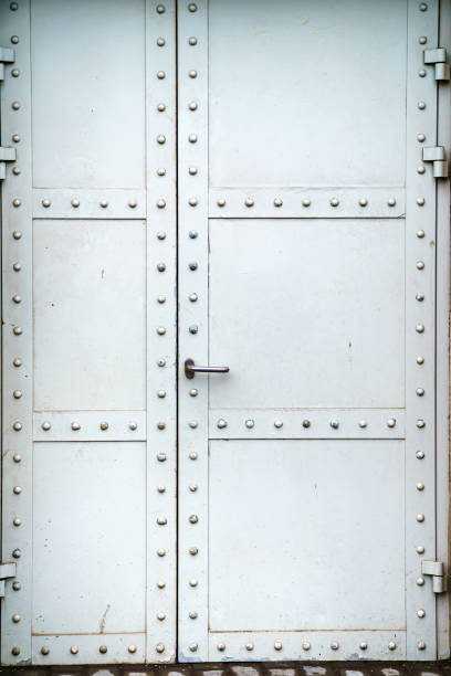 istock Metal door with grey rivets without keyhole 1464207280