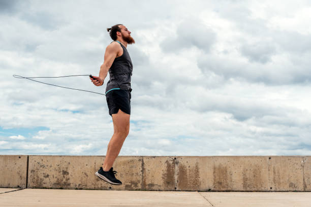 istock Young Man Exercising Near the Coast 1464207330