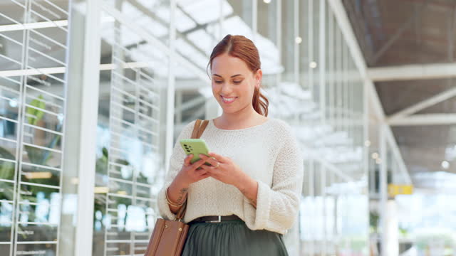 Woman, phone and walking while online for communication, chat or notification at a shopping mall after work while using mobile app for banking. Female on smartphone to with wifi for social network