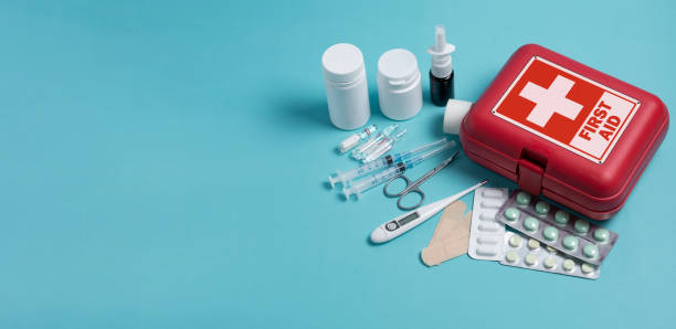 istock Home first aid kit on a blue background. The elements of the first aid kit 1464217115