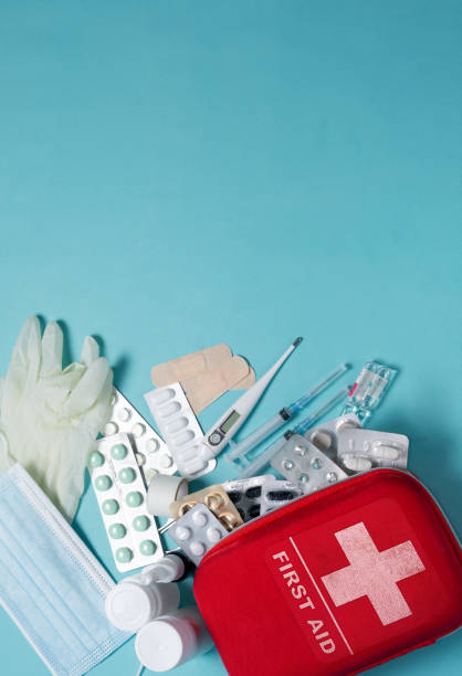 istock Vertical baner for Home first aid kit on a blue background. The elements of the first aid kit 1464217156