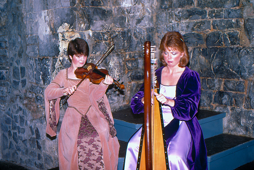 1980s old Positive Film scanned, Folk artists are performing at Knappogue Castle Medieval Banquet, Knopoge, Ennis, County Clare, Ireland.