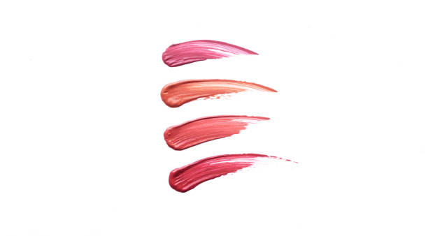 lip gloss or lipstick swatches smudge samples isolated on white background - lip liner fotos imagens e fotografias de stock