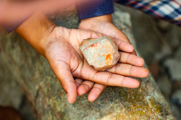 istock Here is a hand on top of another and the background is blurred 1464223100