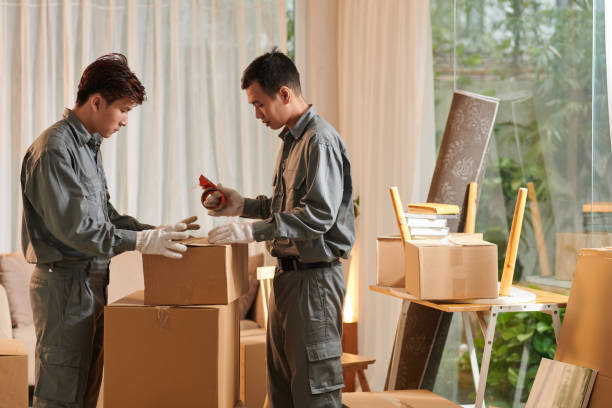 istock Movers Packing Belongings of Client 1464225536