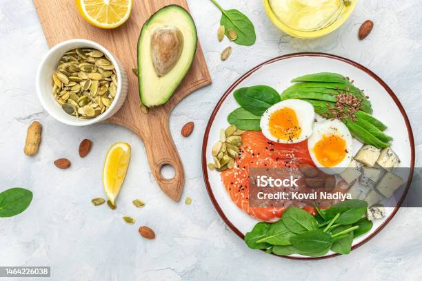 Set Of Diet Food Salmon Avocado Cheese Egg Spinach And Nuts On A Light Background Banner Menu Recipe Place For Text Top View Stock Photo - Download Image Now