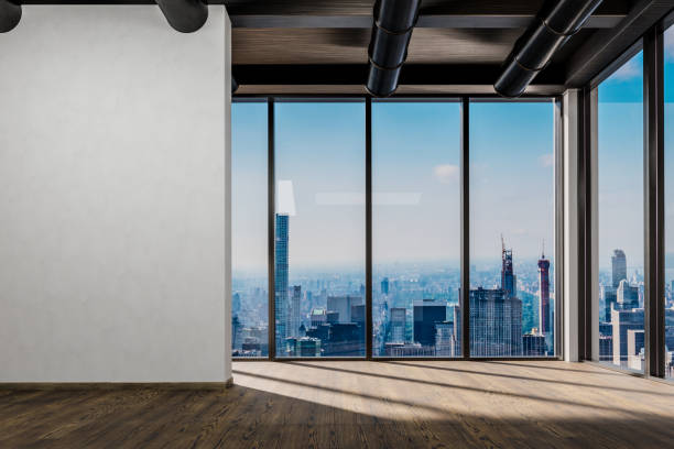 istock large office with blank white wall and copy space in front of panoramic window skyline view, 3D Illustration 1464227482