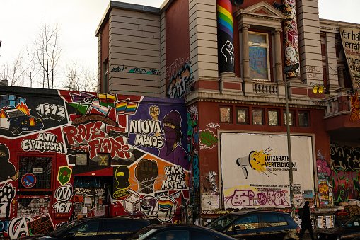 Berlin, Germany - Jan 27th 2023: Peaces of Berlin wall are still standing and currently decorated with street art.
