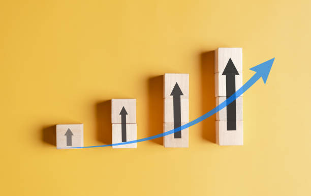istock Stock market and exchange chart concept.  wooden block stack business chart or graph with arrows icon. Stock market and economy growth of investment. 1464232311