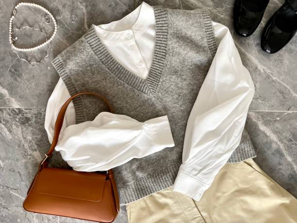 istock gray knit vest and white blouse 1464234522