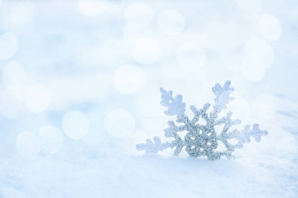 istock Beautiful decorative snowflake on white snow. Space for text 1464236757