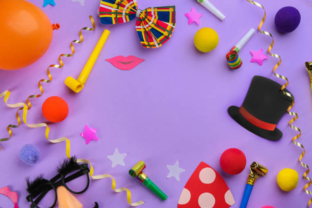istock Frame made of clown's accessories on violet background. Space for text 1464236806