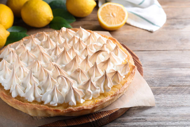 istock Delicious lemon meringue pie on wooden table 1464237328