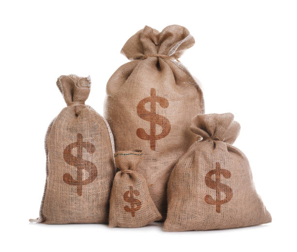 istock Burlap bags with dollar signs on white background 1464237399