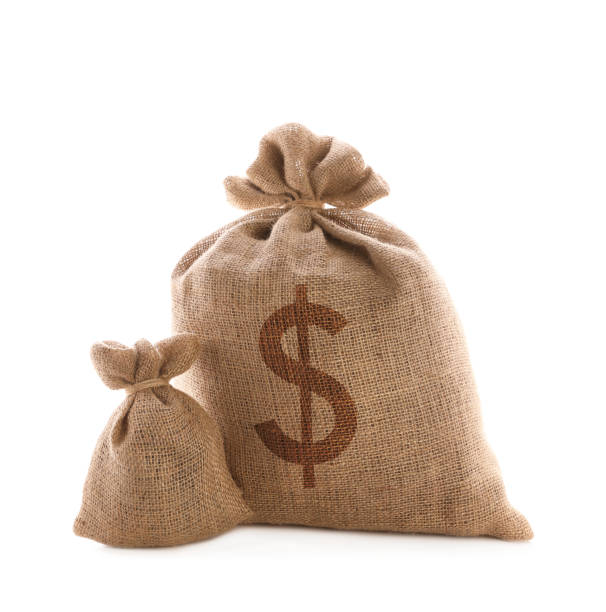 istock Burlap bags and one with dollar sign on white background 1464237589