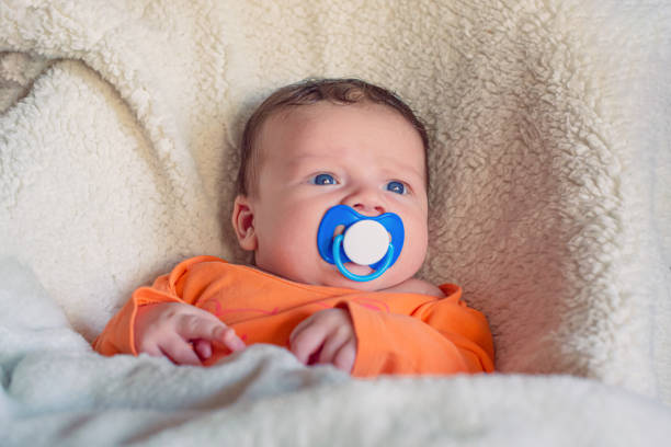 Young toddler boy with comforting pacifier