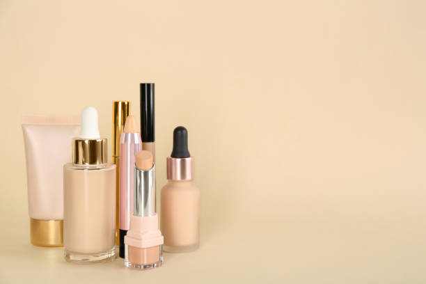 istock Foundation makeup products on beige background, space for text. Decorative cosmetics 1464240191