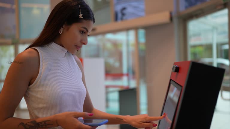 Young woman using tech machine university entrance