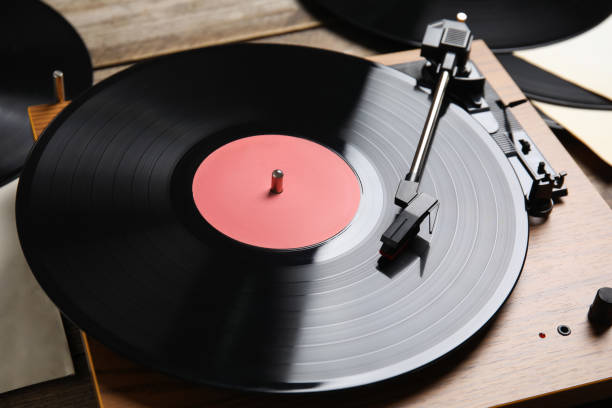 istock Modern player and vinyl records, closeup view 1464240415