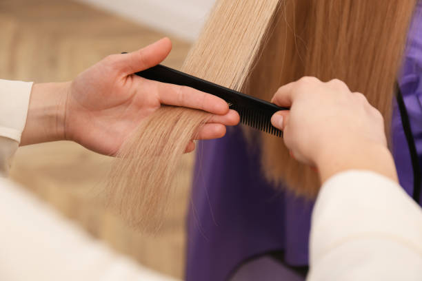 istock Stylist working with client in salon, closeup. Making haircut 1464240524