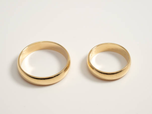 istock Wedding rings on a light background. Gold rings. 1464242633