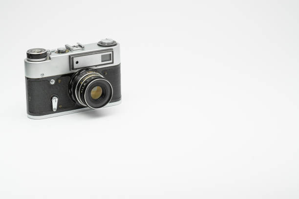 Old vintage film camera isolated on white backgorund. Copy space