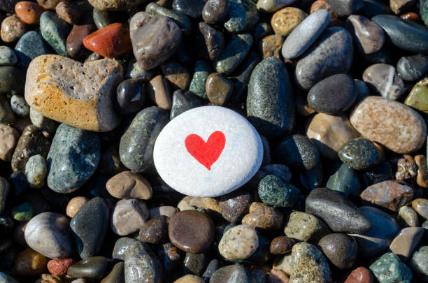 Red heart beautifully painted on stone. Valentine's Day