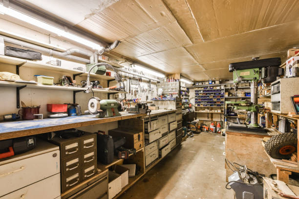 a garage with lots of clutters on the walls and ceiling above it is an open workbench
