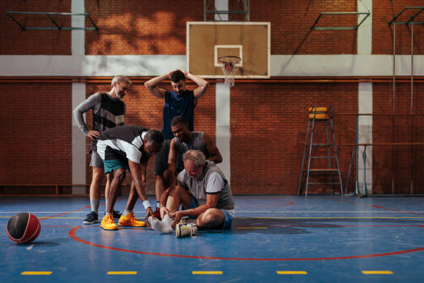 istock Man in pain at basketball game. 1464255343