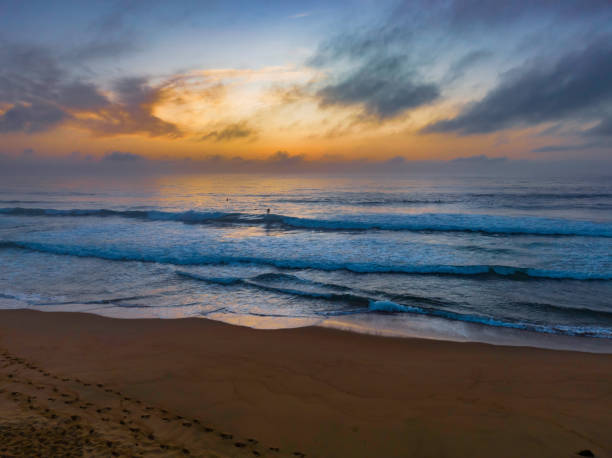 istock Summer sunrise at the seaside with clouds and haze 1464255881