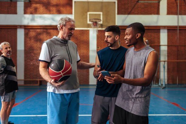 istock Young players check social media during game. 1464255892