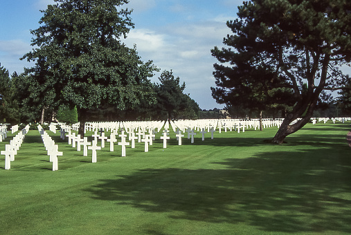 Omaha Beach, Colleville-sur-Mer,  Normandy, France - aug 13, 1997: in the American cemetery of Colleville-sur-Mer, long lines of simple white crosses commemorate the sacrifice of the soldiers who fell during the battle of Normandy.