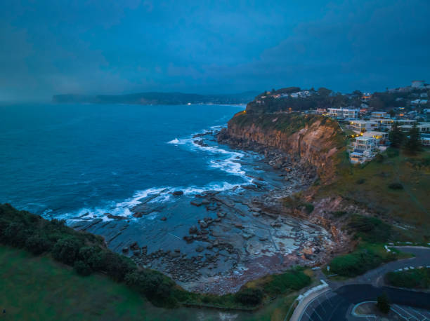 istock Hazy Summer Sunrise Seascape and Rocky Inlet 1464256253