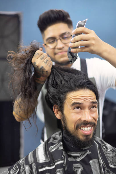 istock Customer scared of having his hair cut with a machine 1464266175